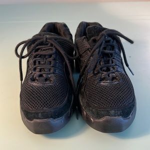 Bloch black dance sneakers.  Suede trim but primarily synthetic materials.